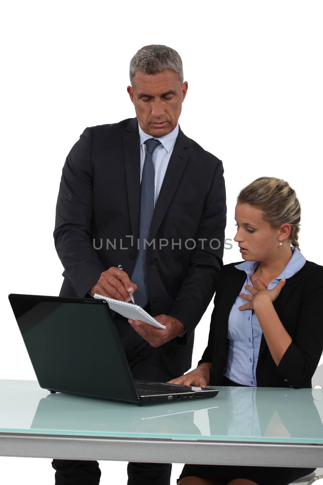 Boss handing note to young assistant