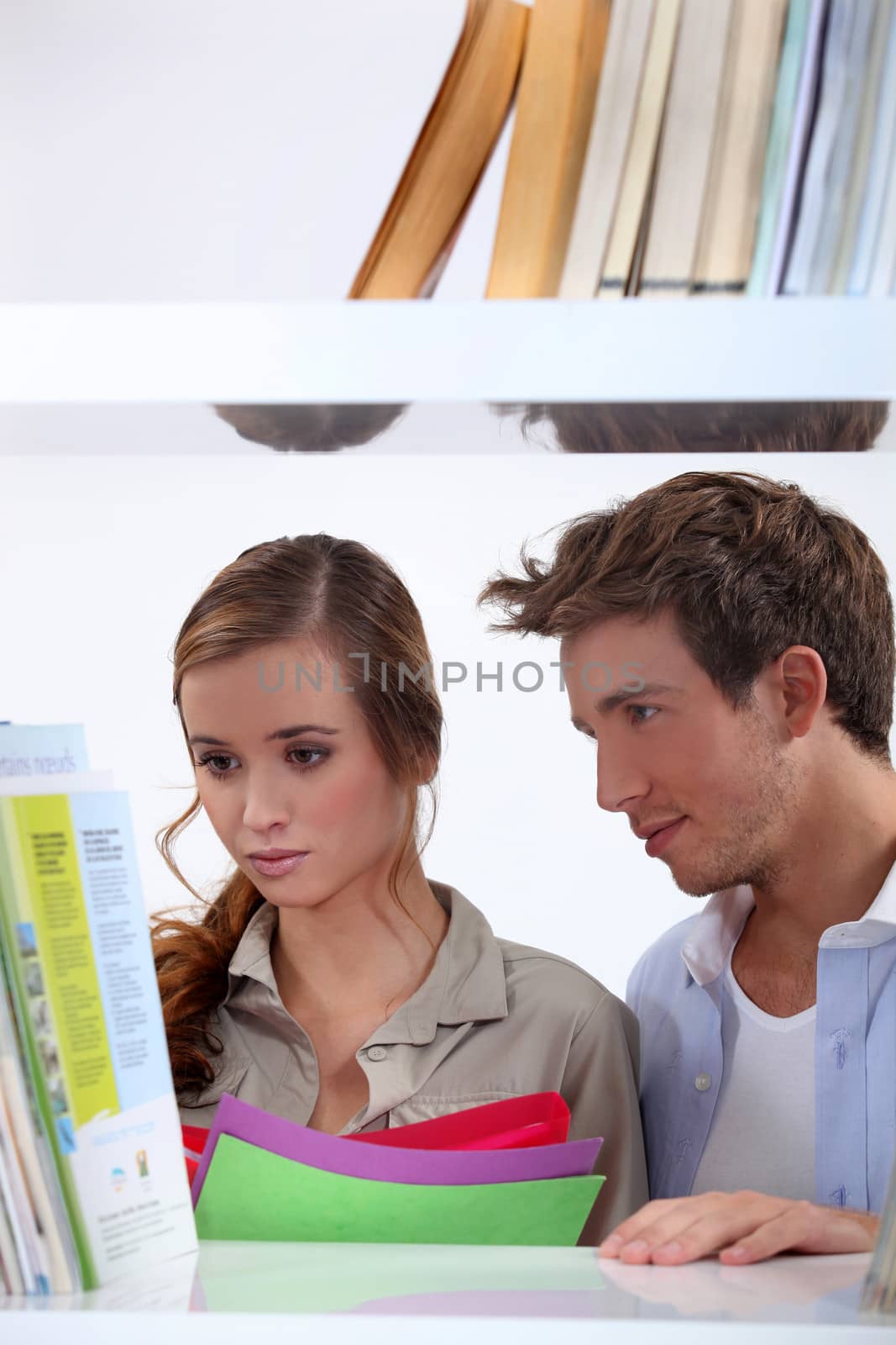 Couple in a library by phovoir