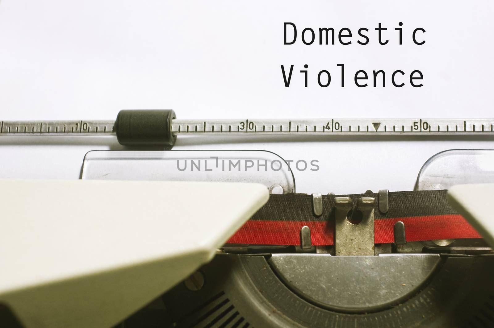 domestic violence concept, with message on typewriter paper.