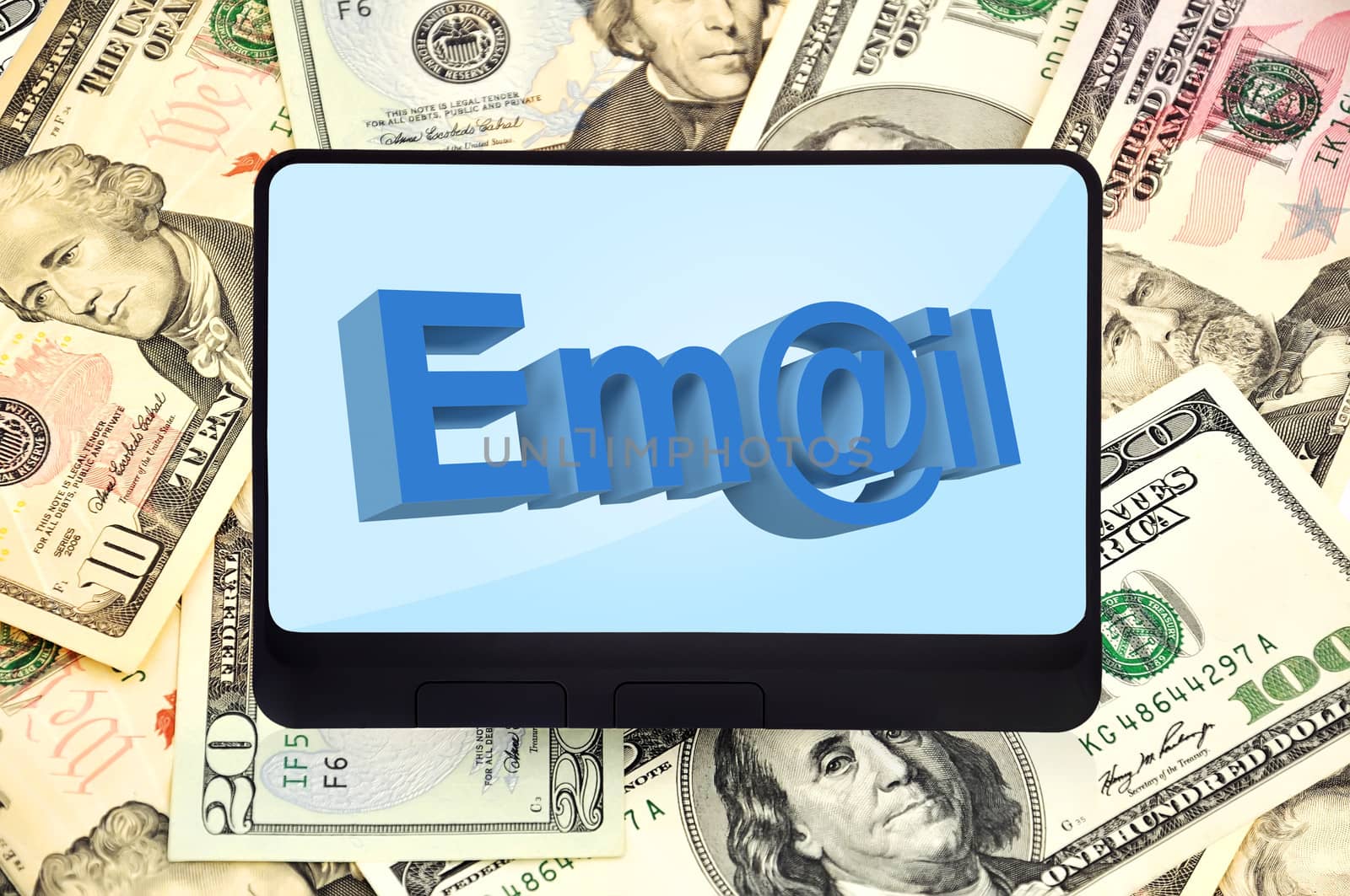 digital tablet with mail symbol on background of dollars