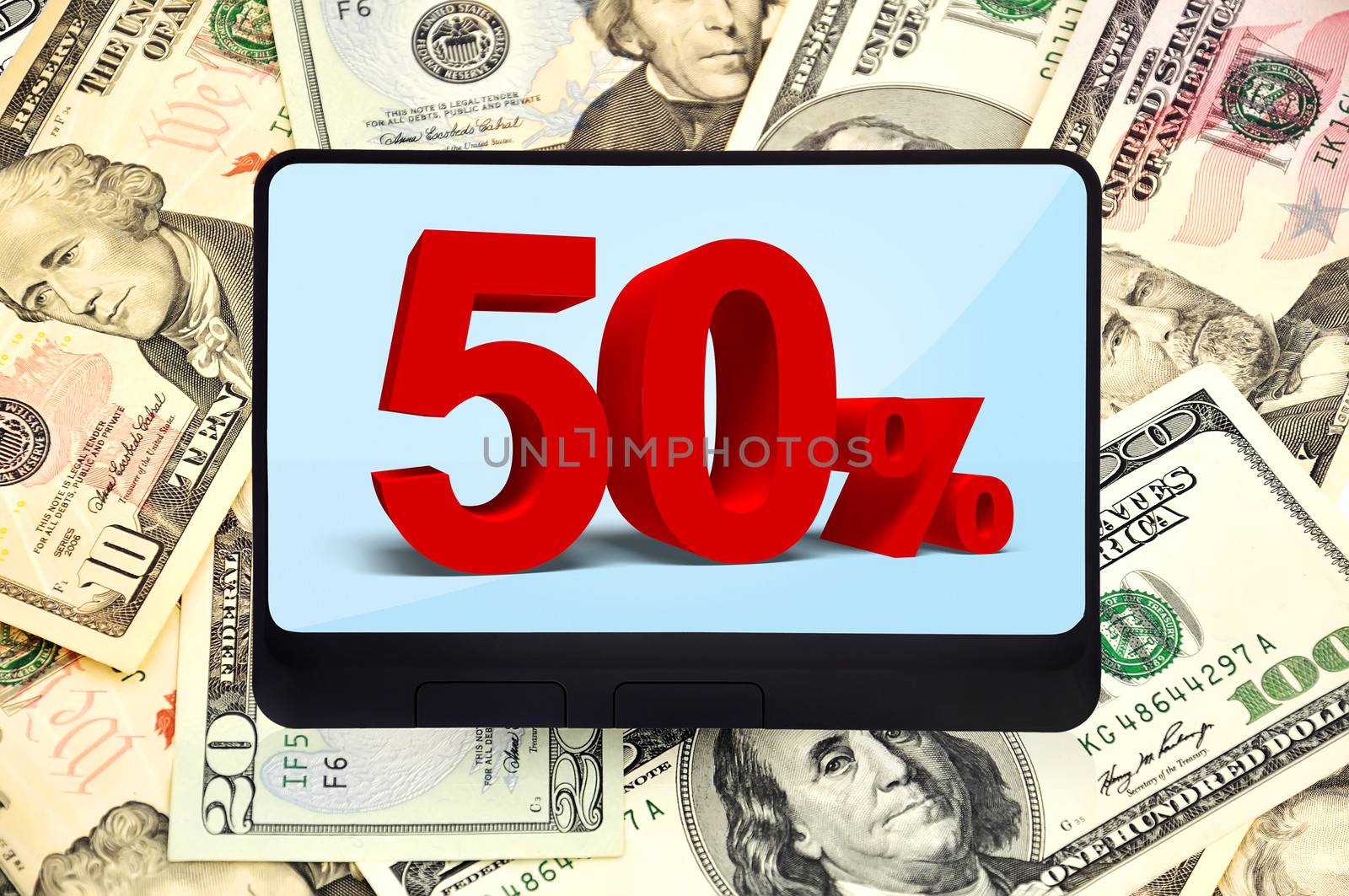 digital tablet on background of dollars
