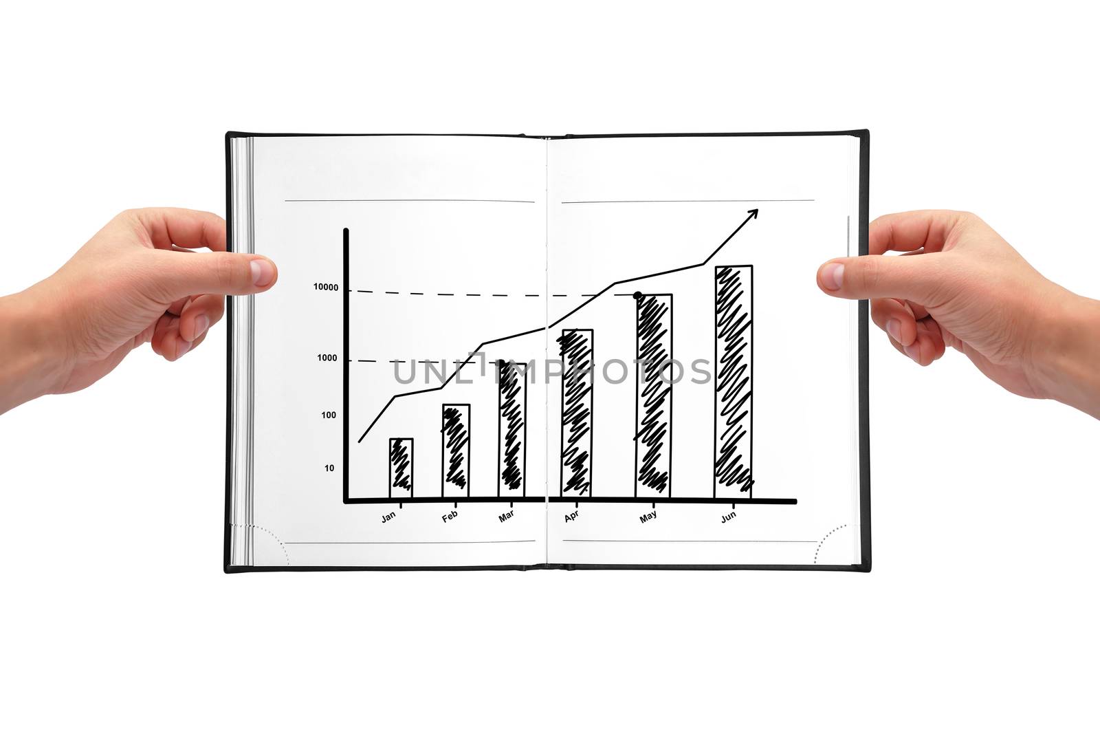 Hands holding book with graph of growth