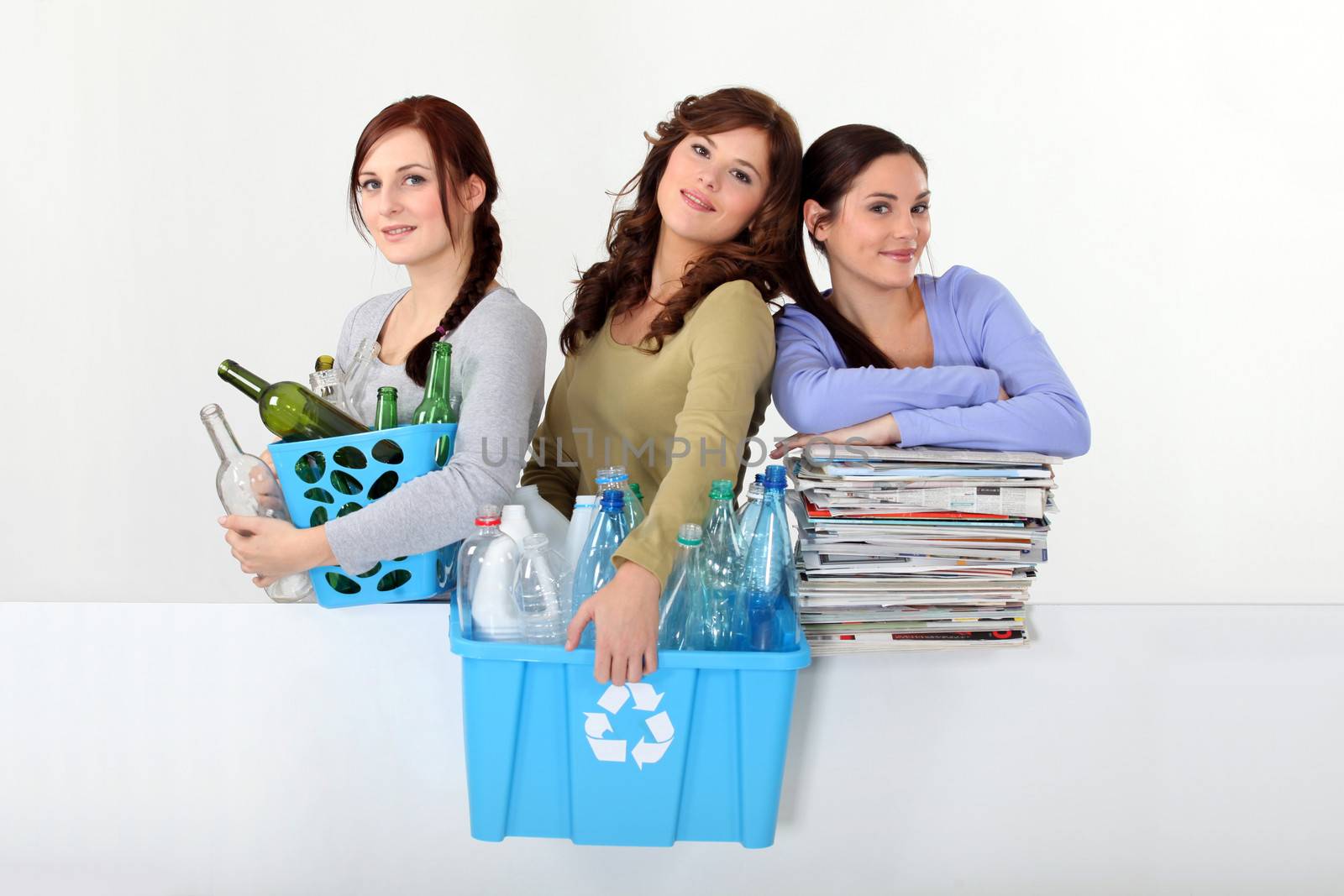 Young women recycling by phovoir