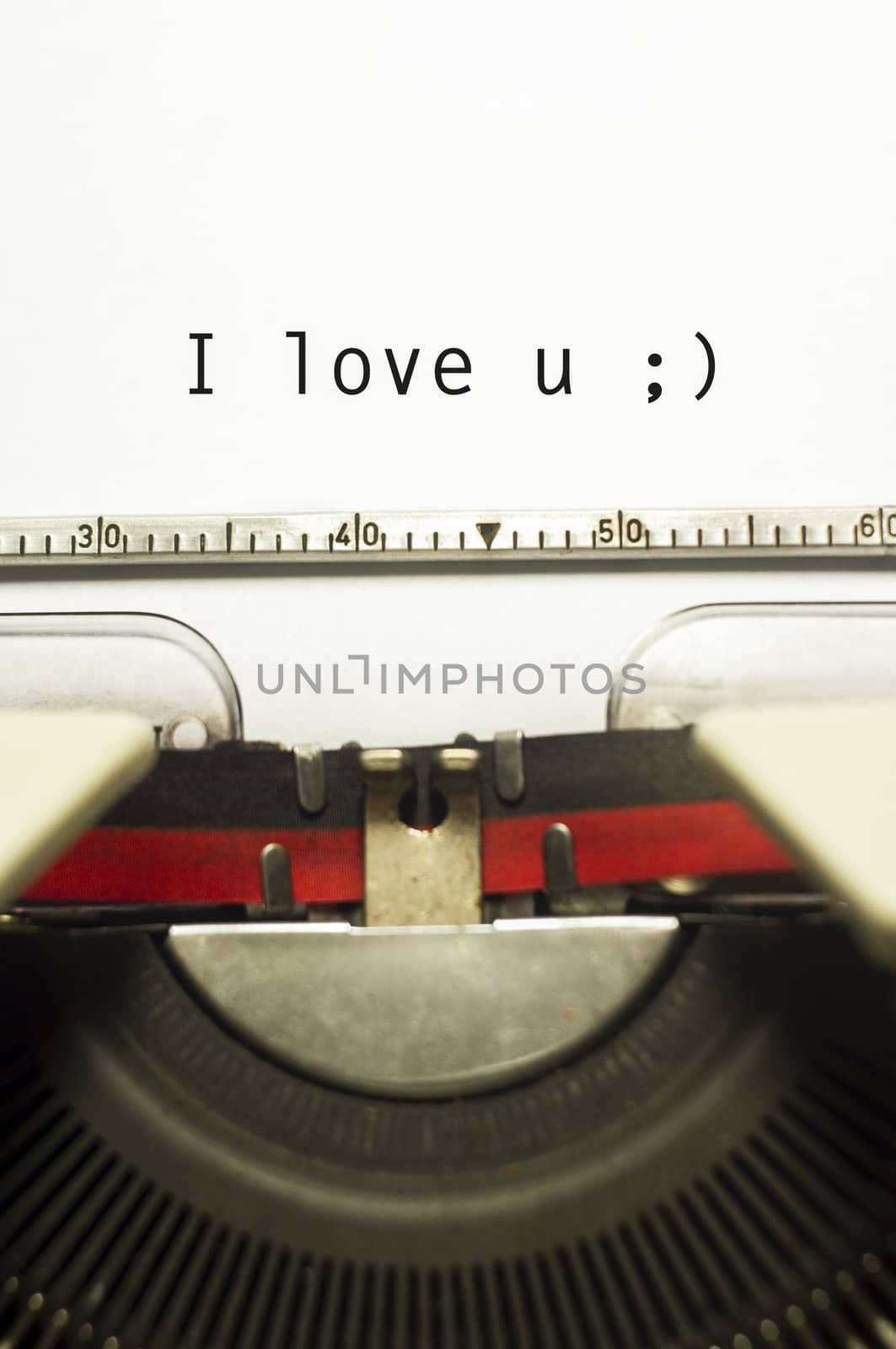 a close up of typewriter, focus on paper where message will be typed.