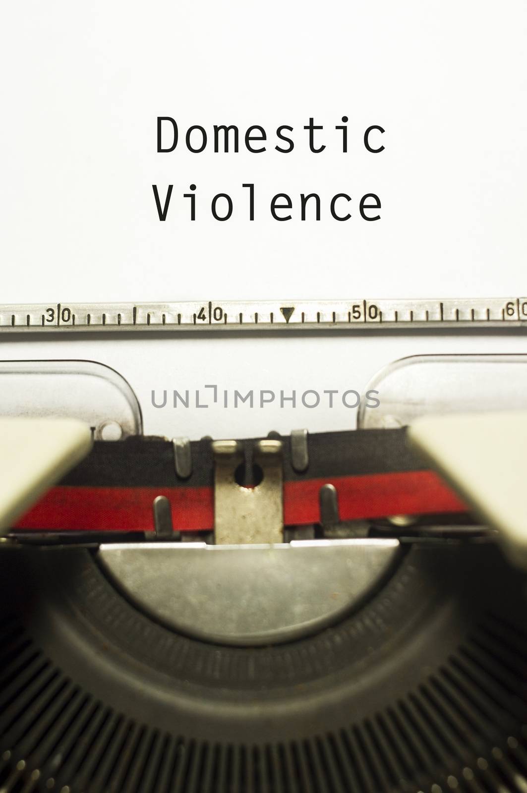 domestic violence concept, with message on typewriter paper.