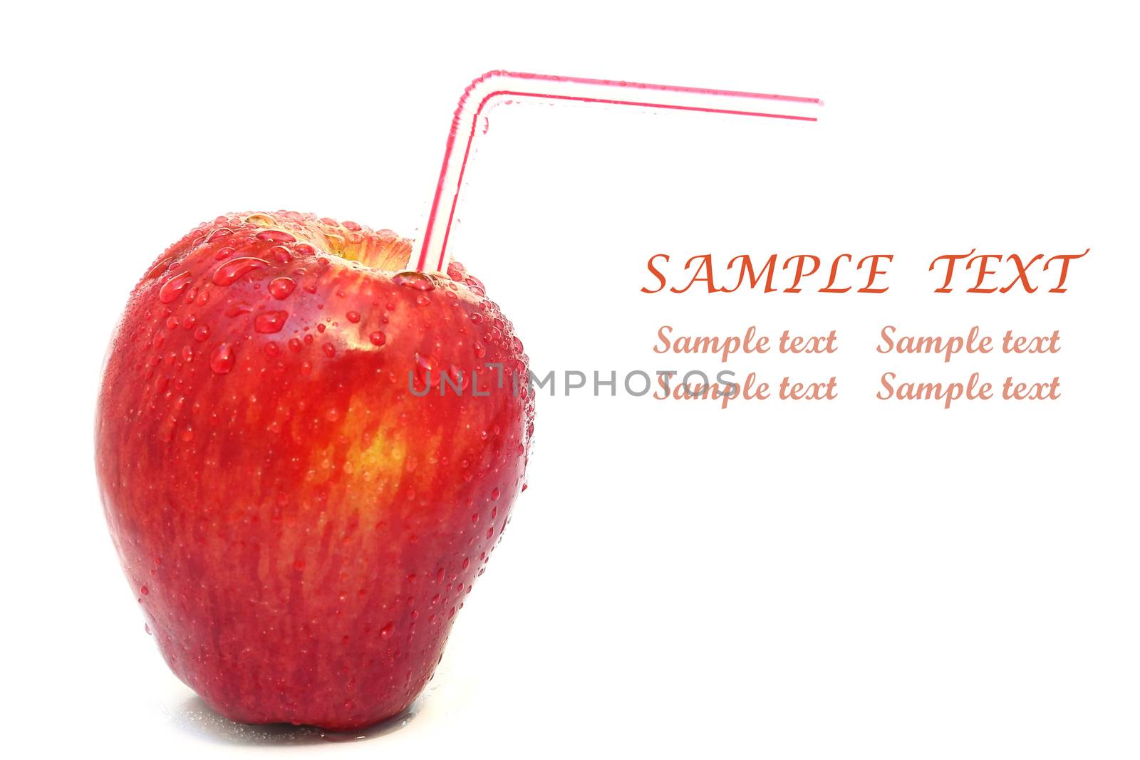 Red apple with water drops and a straw isolated on white background
