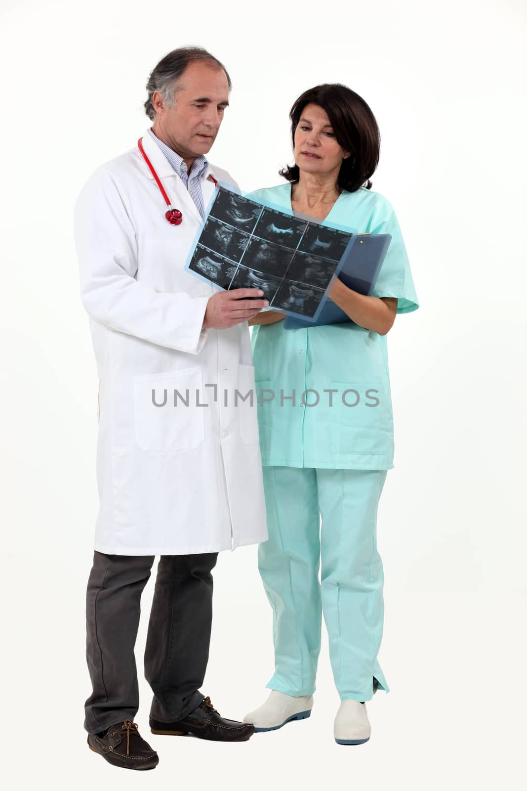 Doctor and nurse looking at x-ray