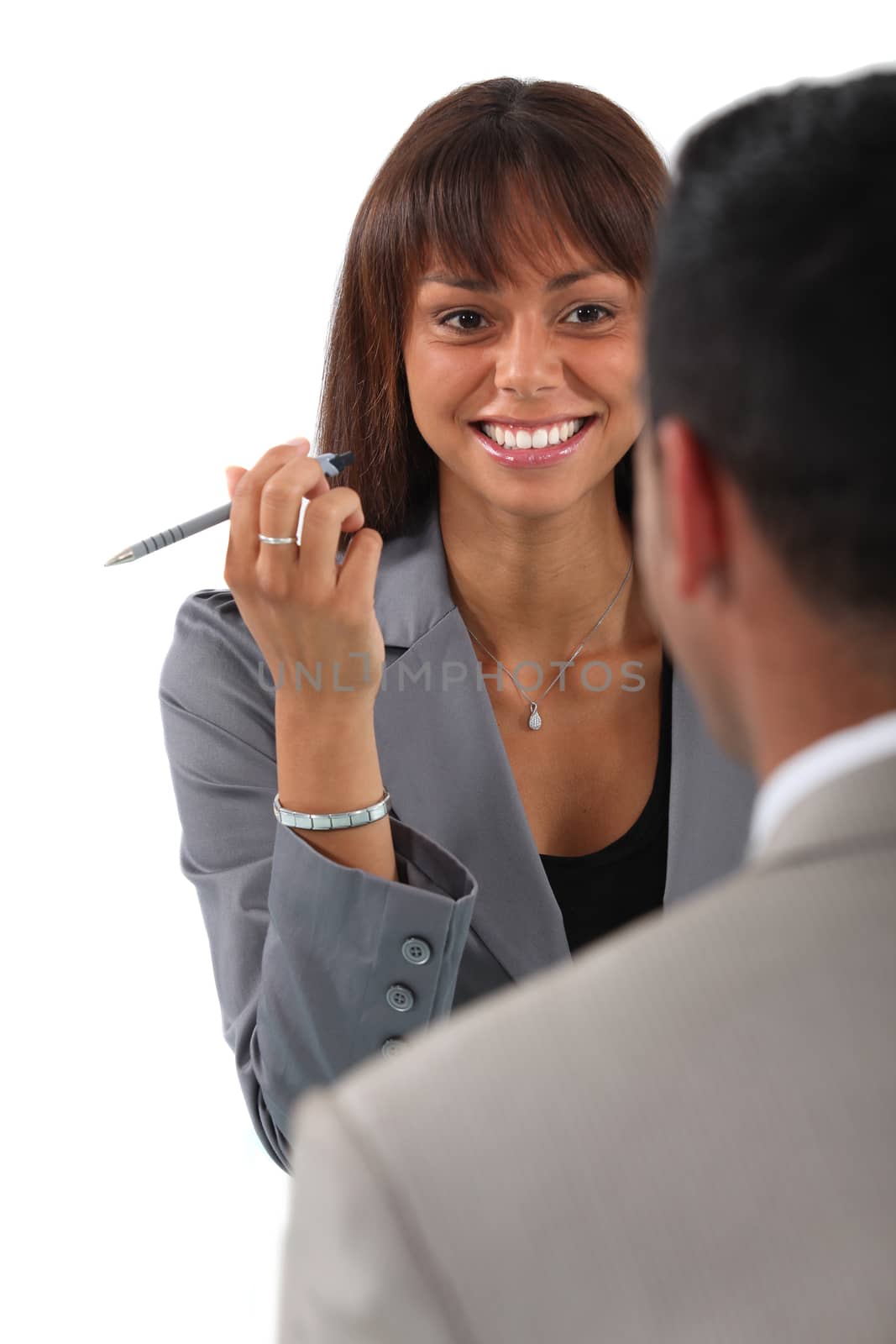 businesswoman and businessman having a discussion by phovoir