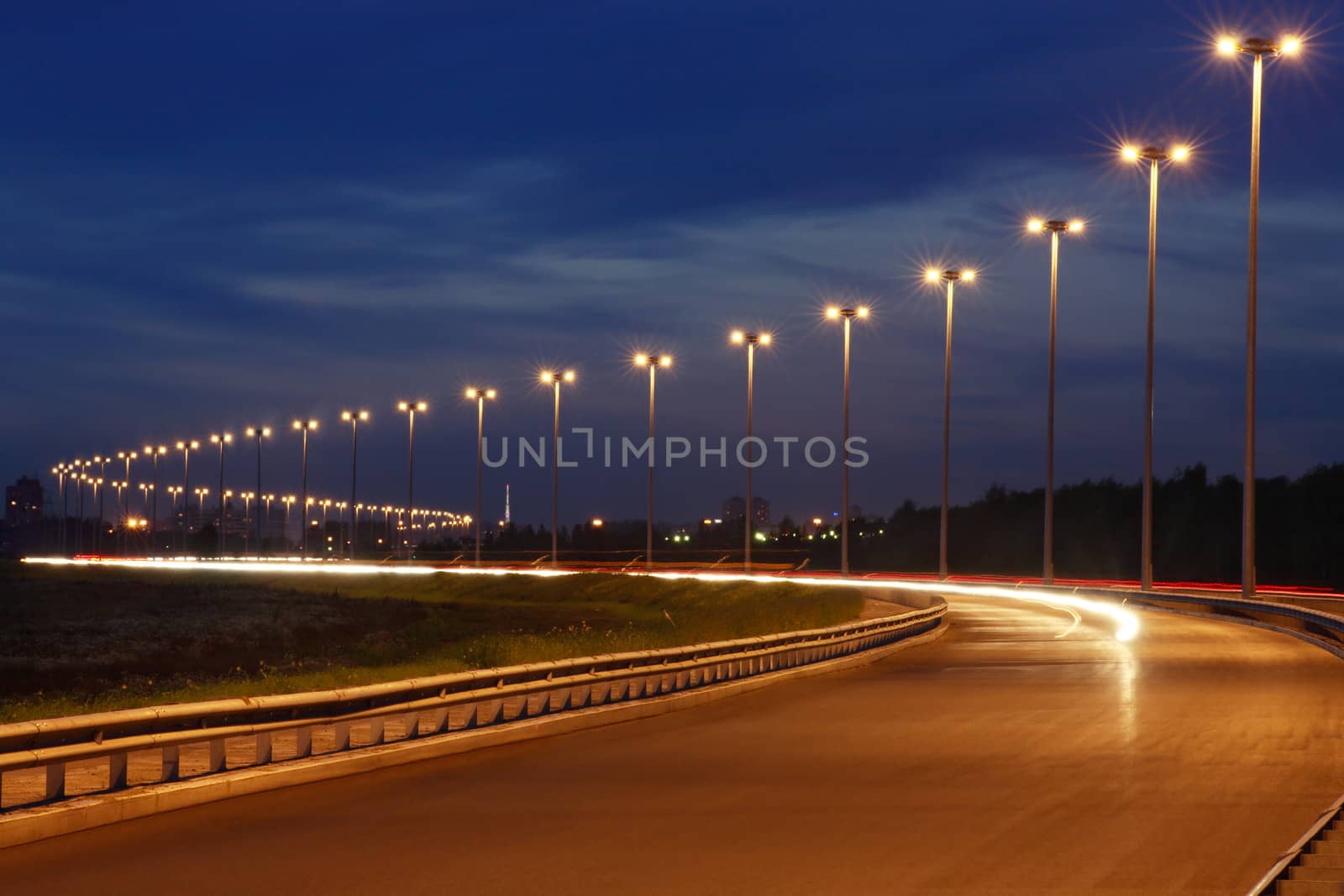 Electric on night road, illumination on the highway, horizontal.