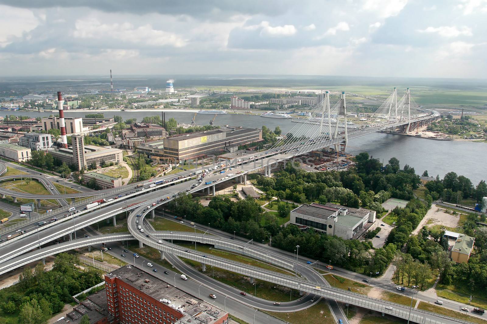  ST-PETERSBURG, RUSSIA - JULY 19: Road interchange Ring Road and Avenue Obukhovskoy Oborony, before the bridge Bolshoi Obuhovsky. The Russian Federation, St. Petersburg, July 19, 2007. The bridge is under construction the second part. Under the bridge the river Neva. Taking pictures is made from a helicopter. Editorial image.