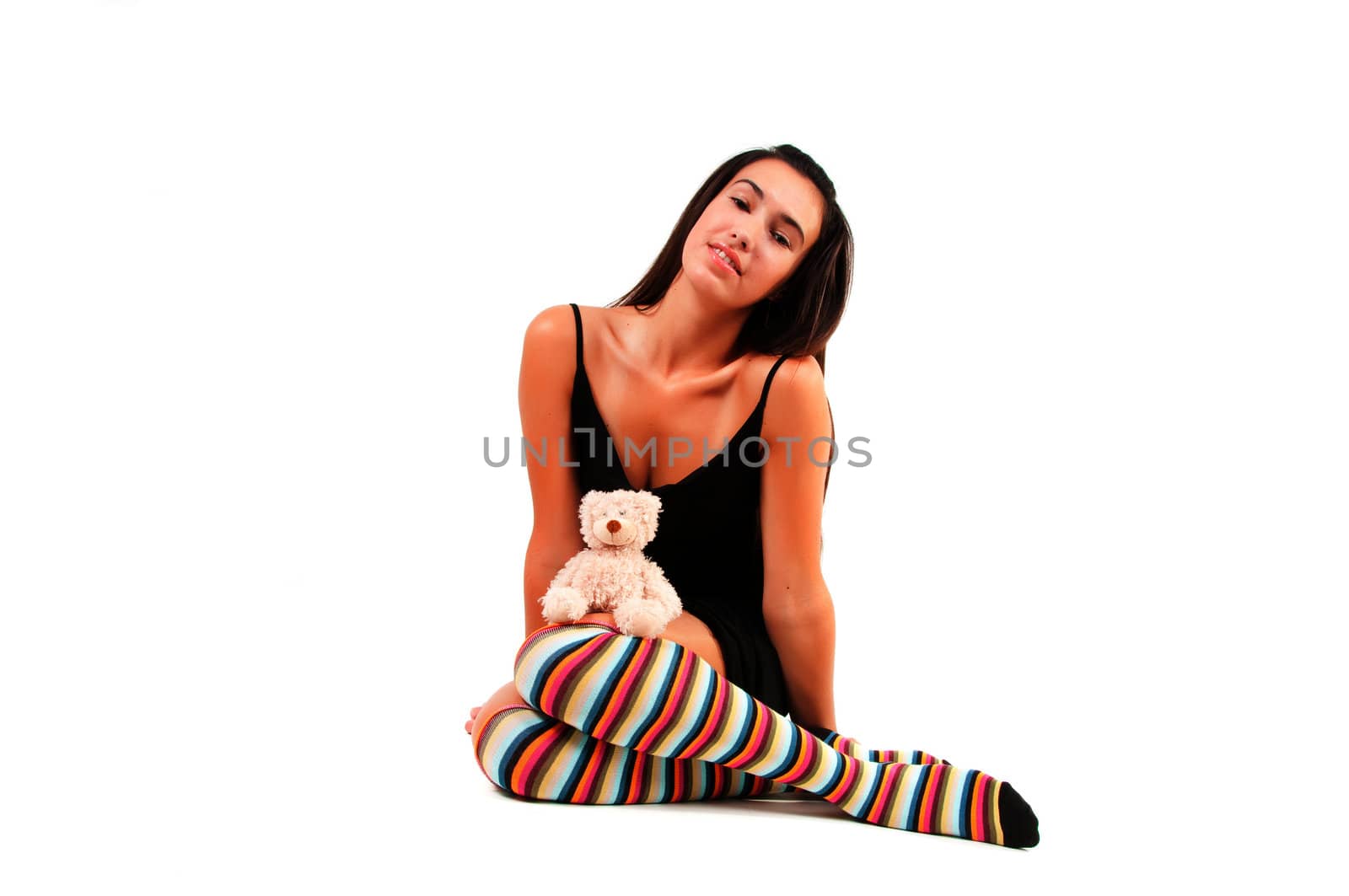 Shot of woman in multicolored stockings sitting onthe floor