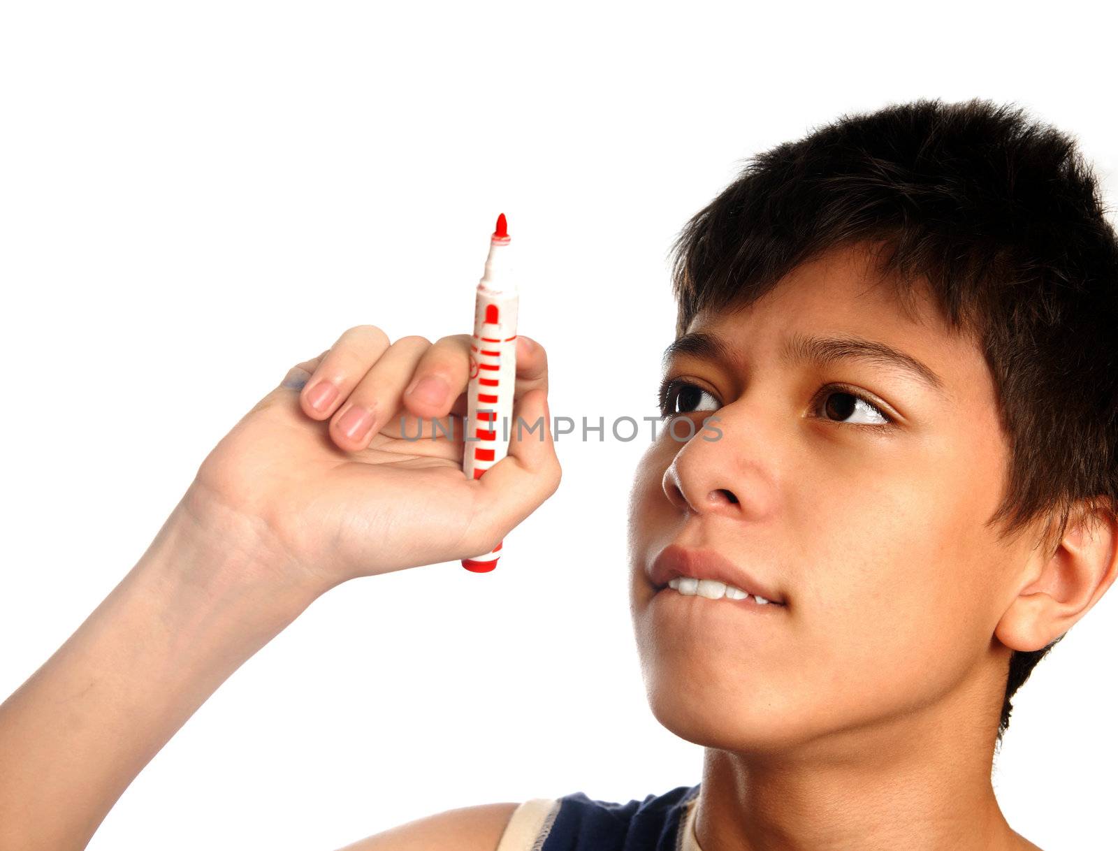 Studio photo of the boy indented to write or draw