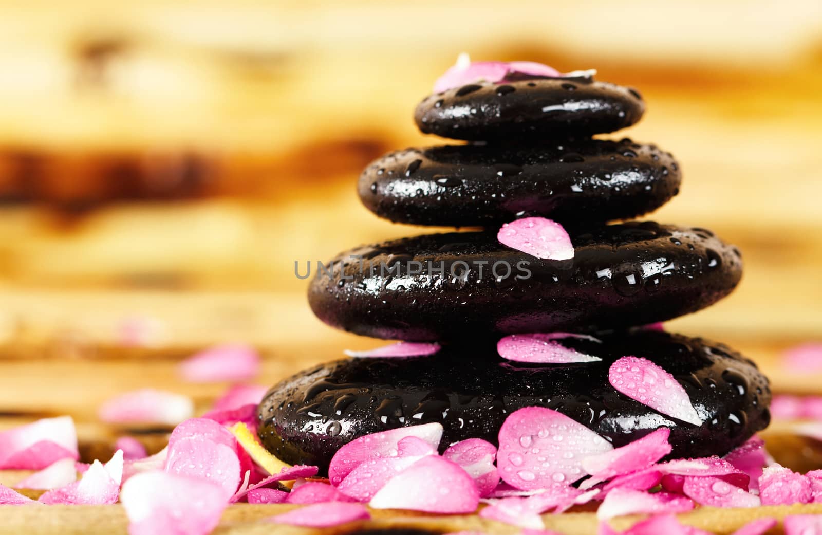 Spa stones with rose petals