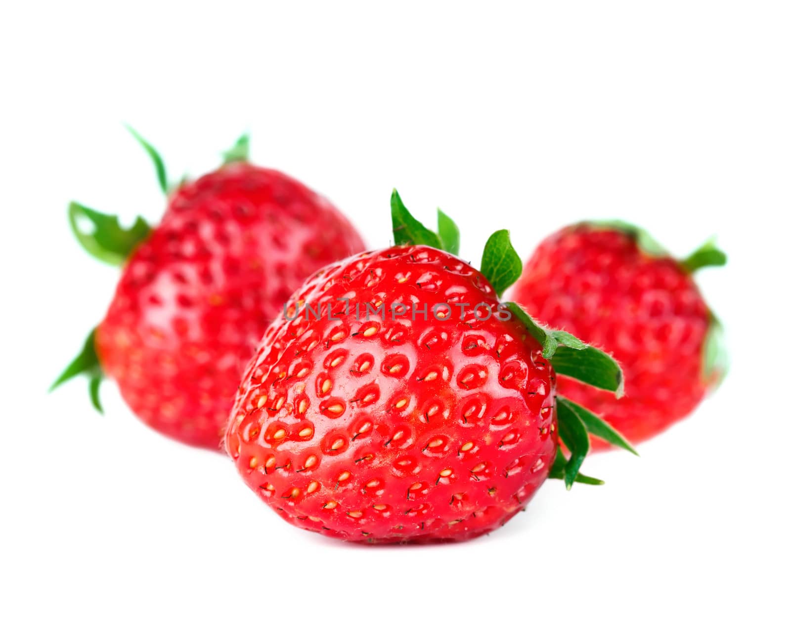 Beautiful ripe red fresh appetizing strawberries with leaves. Isolated on a white background.