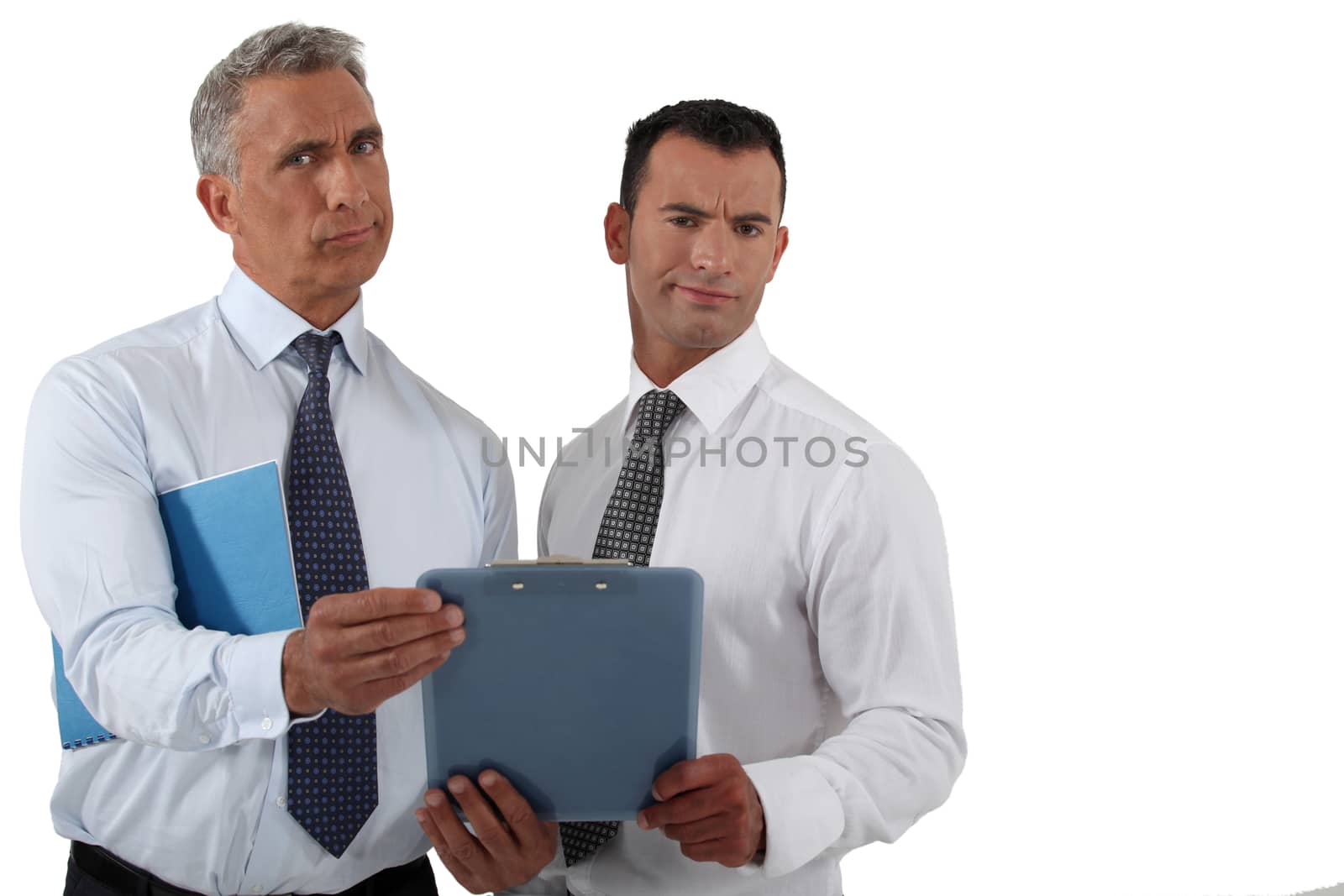 Two frowning businessmen holding clip-board by phovoir