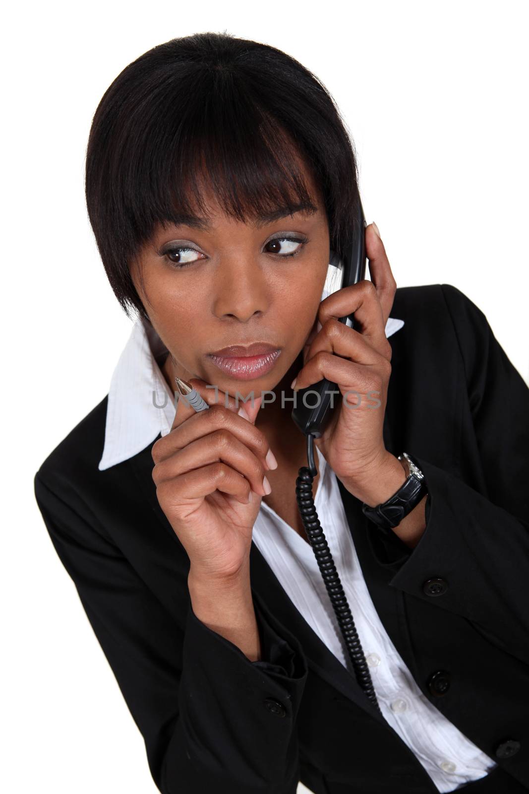 Woman paying attention during phone call by phovoir