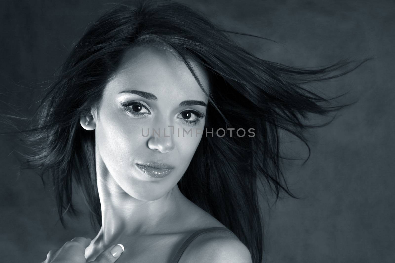 Portrait of the beautiful brunette in studio