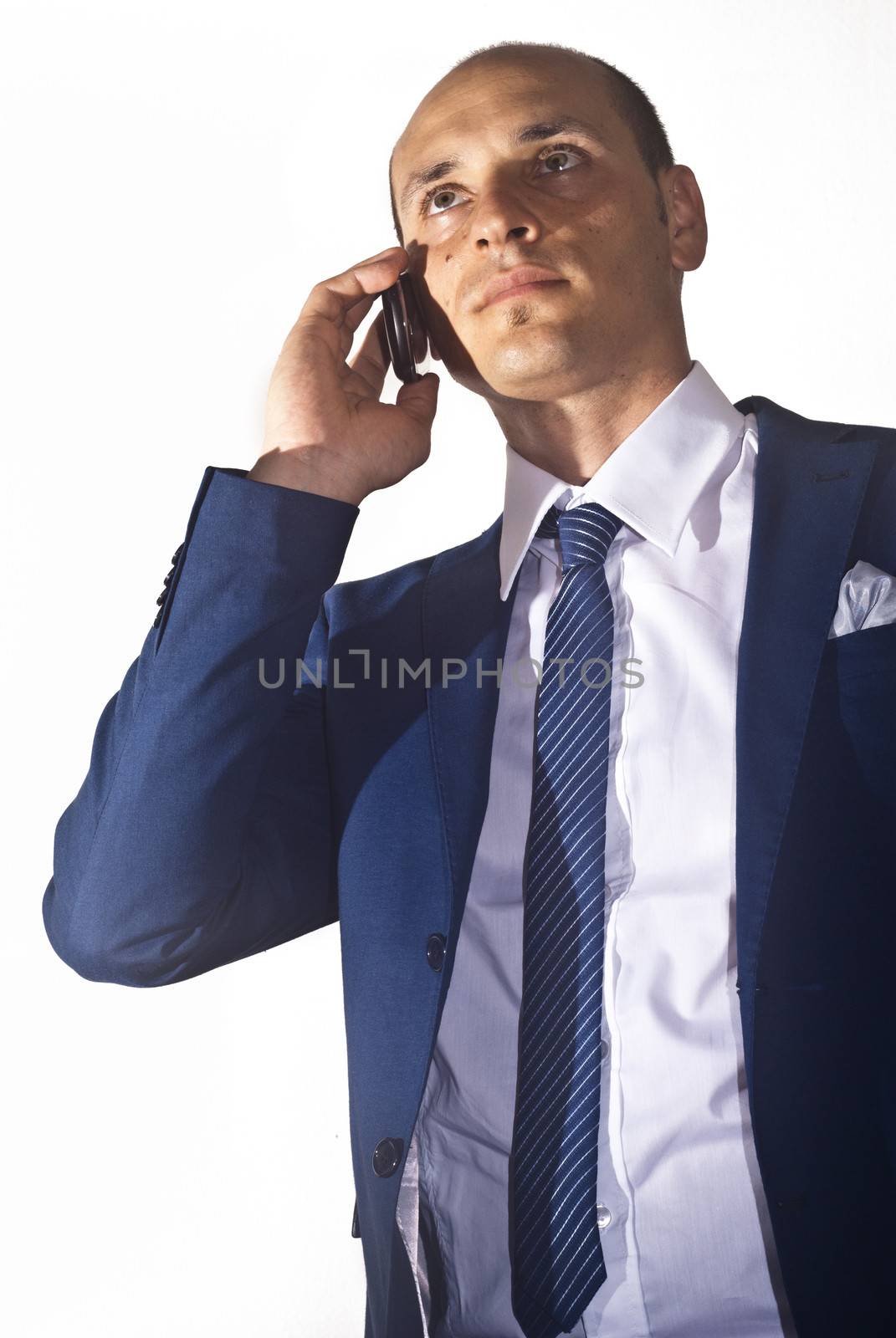 elegant businessman wearing suit talking on the phone