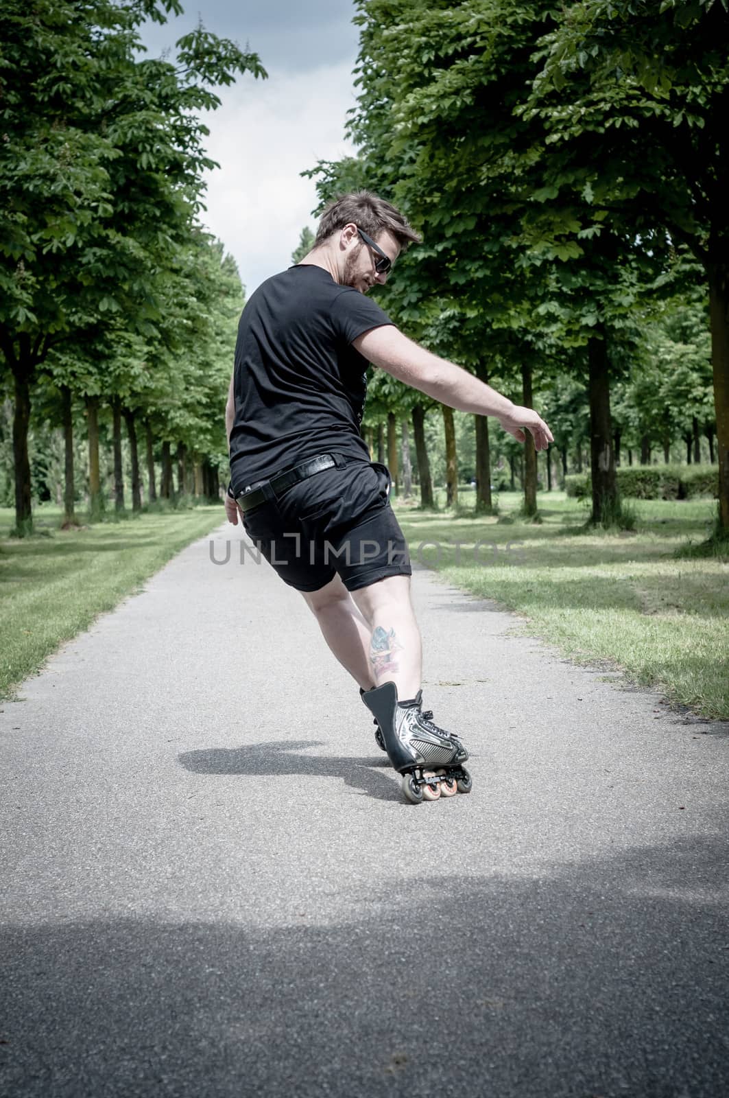 stylish man in the park in a sunny day
