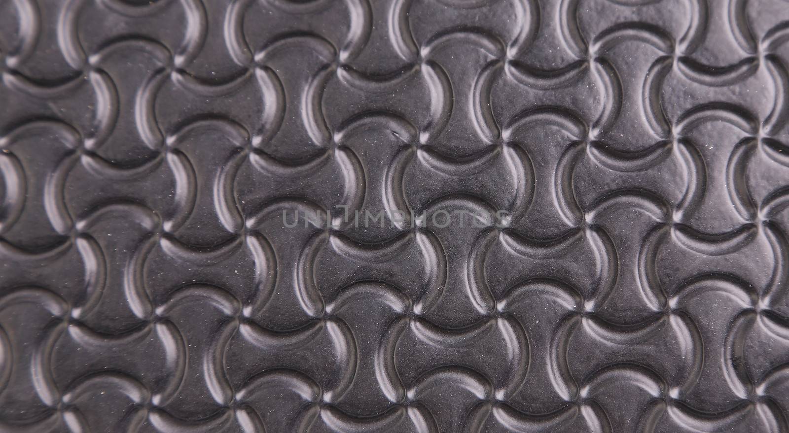 Black background with a pattern of stylized infinity