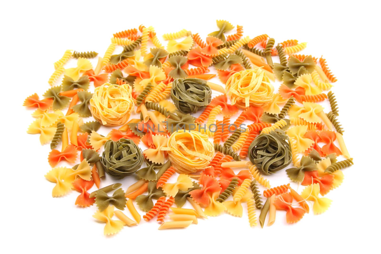 A different pasta in three colors on the white background.