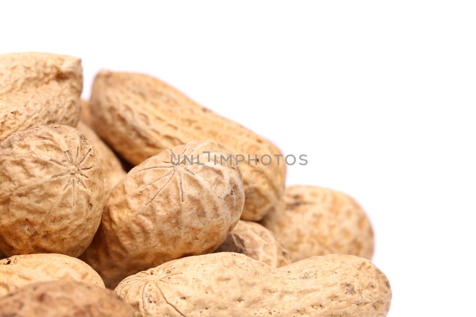Frame close-up of some peanuts. by indigolotos