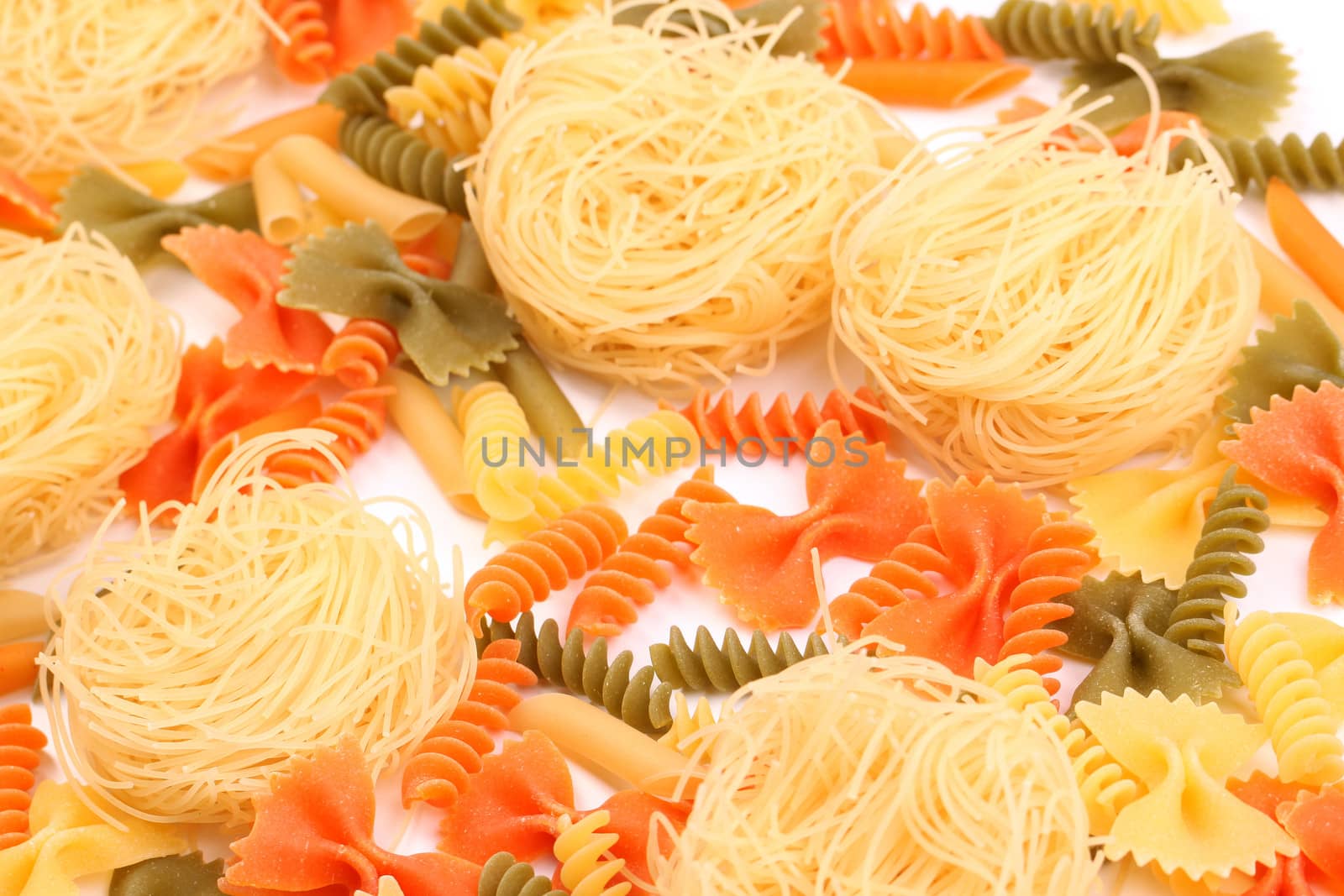 A different pasta in three colors close-up. by indigolotos
