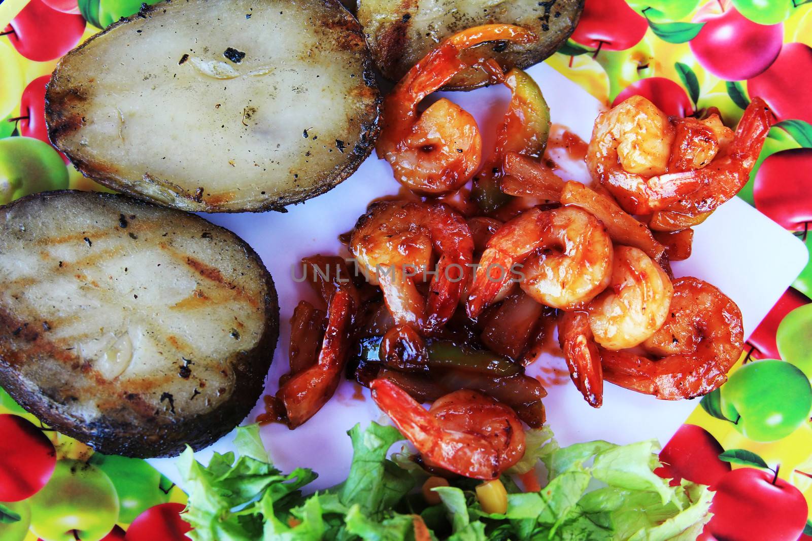 prawn in sweet red sauce with a potato and vegetables