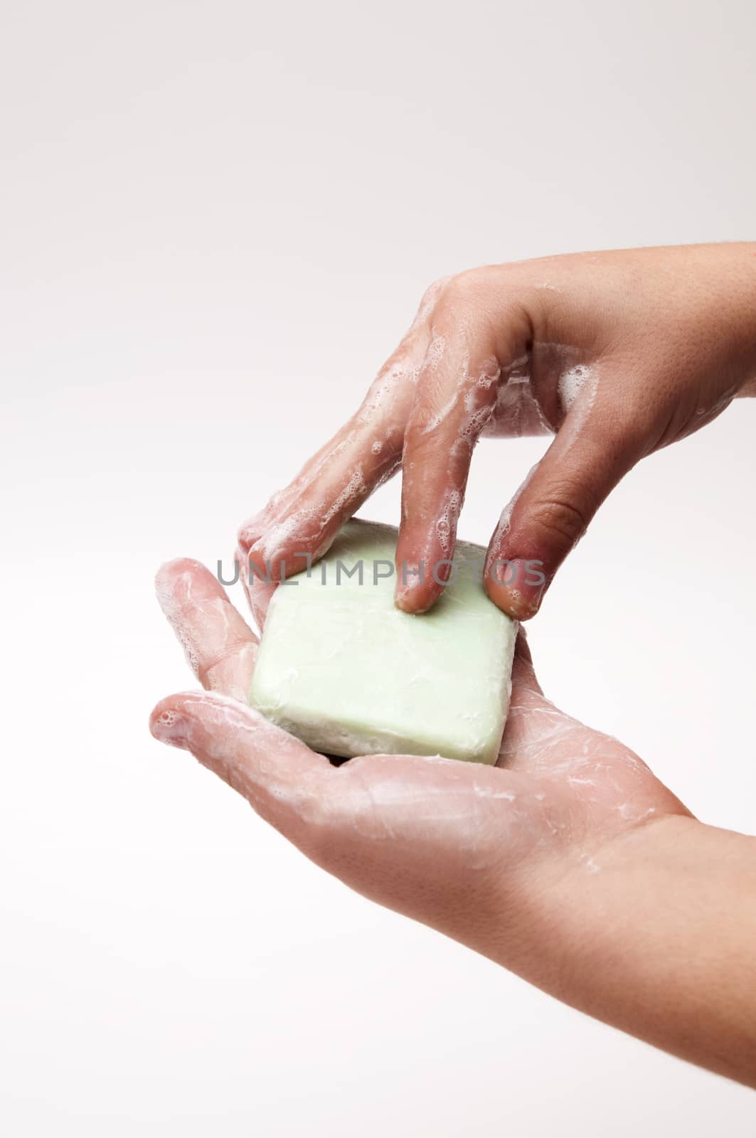 hands with soap on a white background