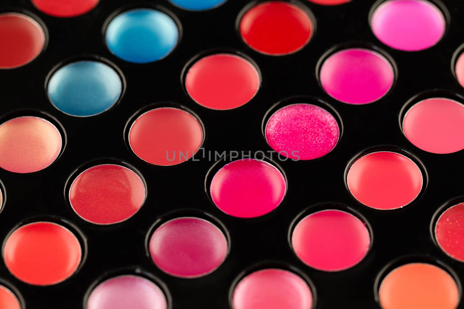 Close-up shot of lip gloss palette, soft focus