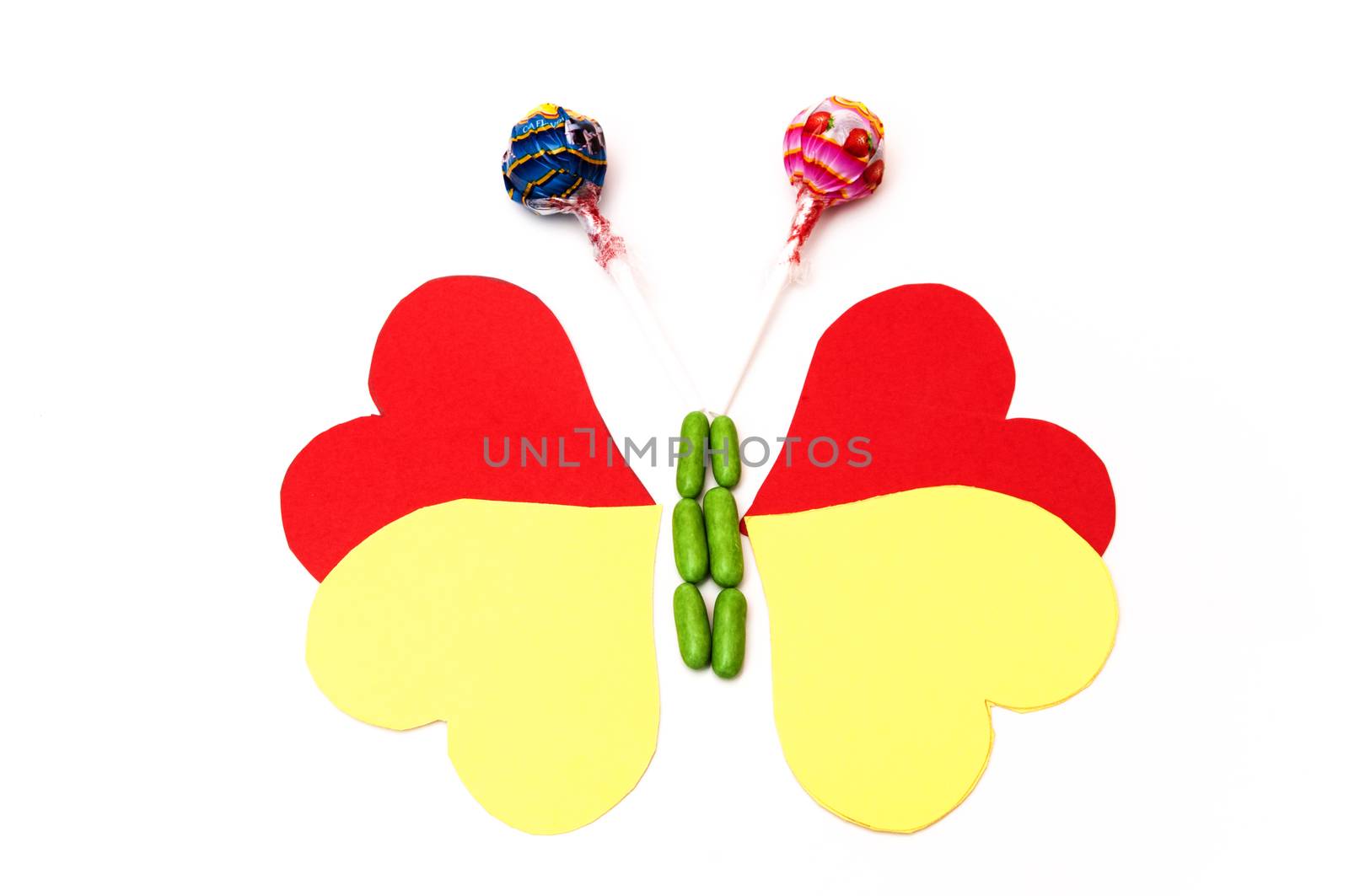 drawing of a butterfly with hearts and candy on a white background