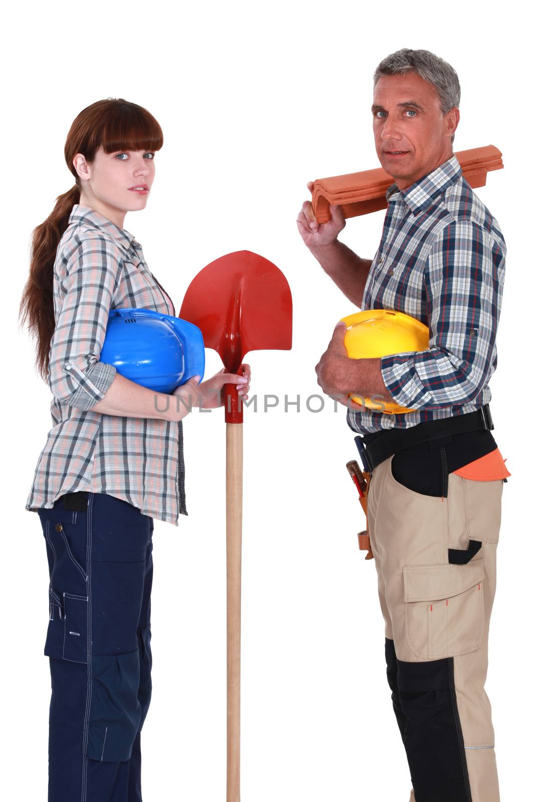 Male and female roofers stood together by phovoir