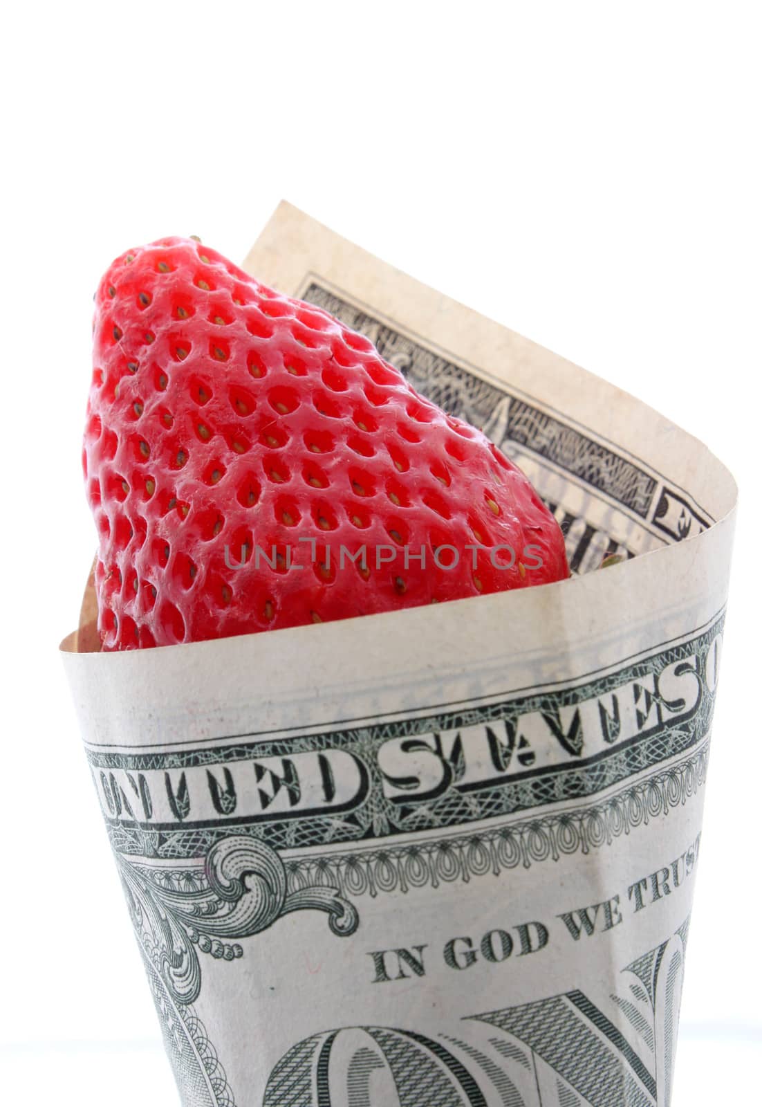 strawberry wrapped in one dollar banknote