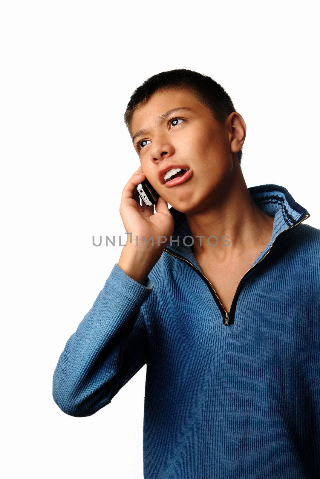Boy talking via mobile phone and hearing bad news