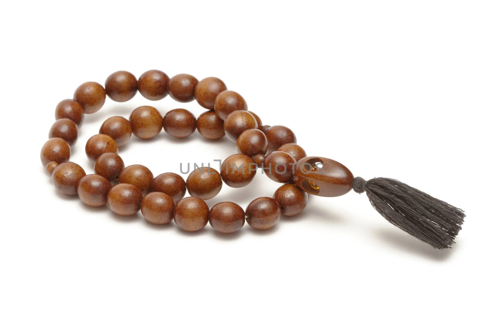 Wooden rosary on white background