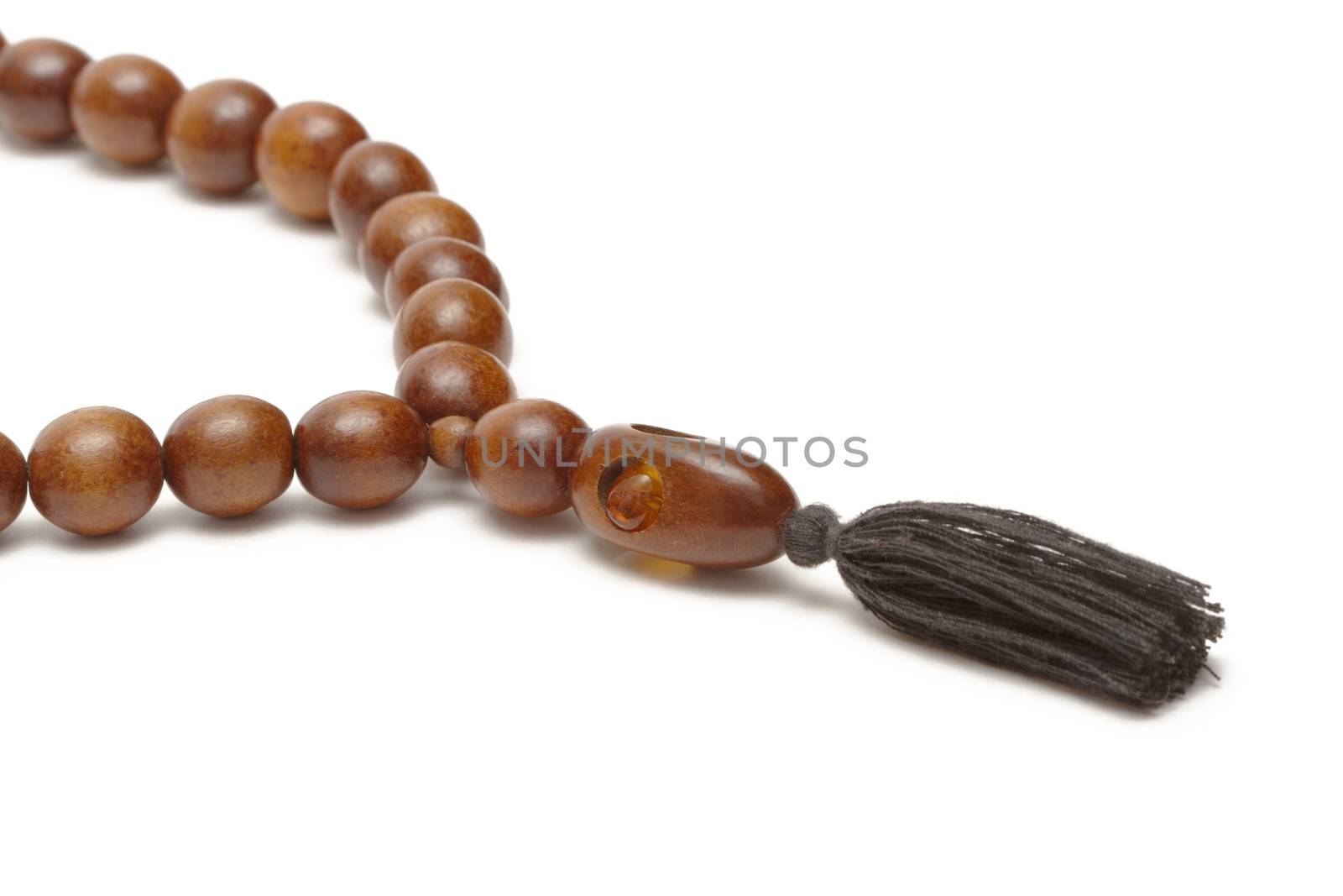 Wooden rosary on white background