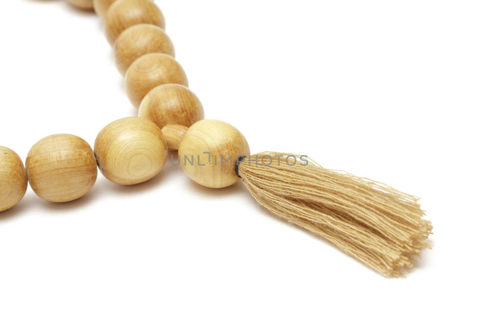 Wooden rosary on white background