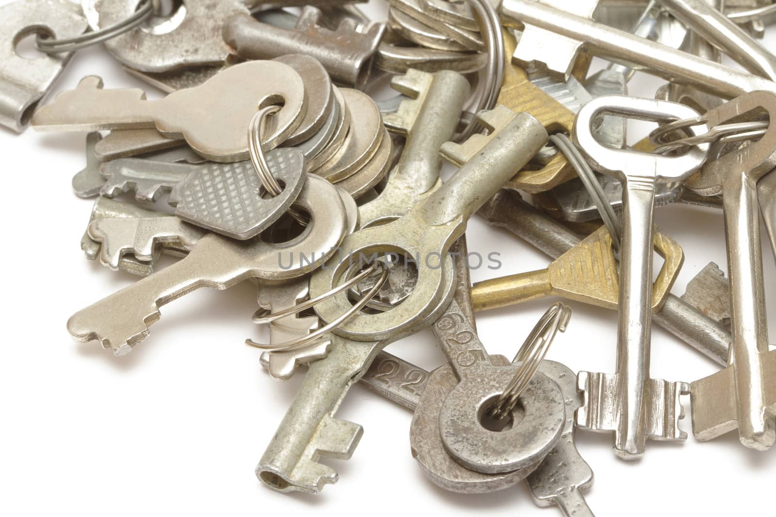 Heap of keys on white