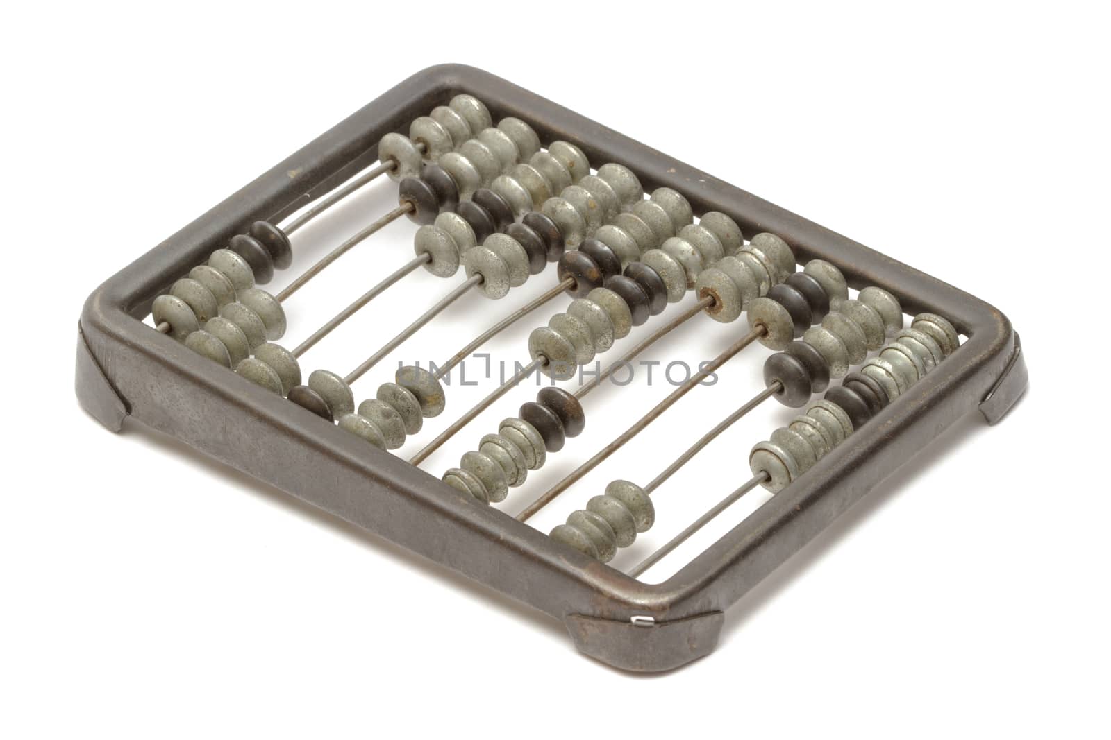 Old metallic abacus on white