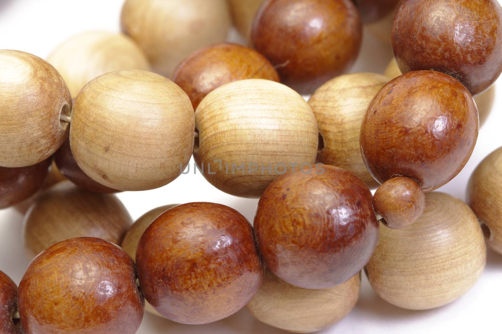 Wooden rosary on white background