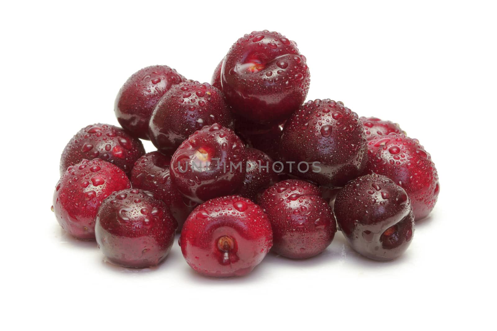 Ripe cherries on white background