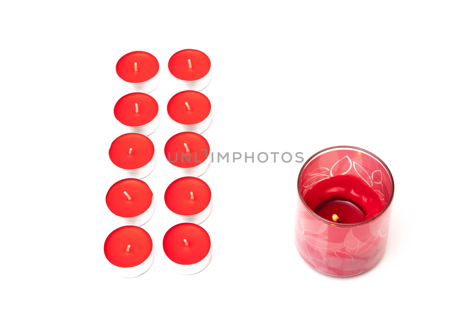 red colored candles on a white background