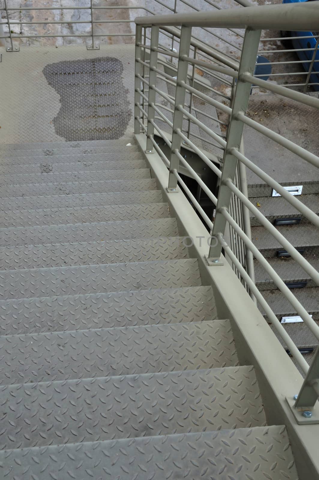 Pedestrian footbridge iron stairway urban overpass bridge above the motorway.