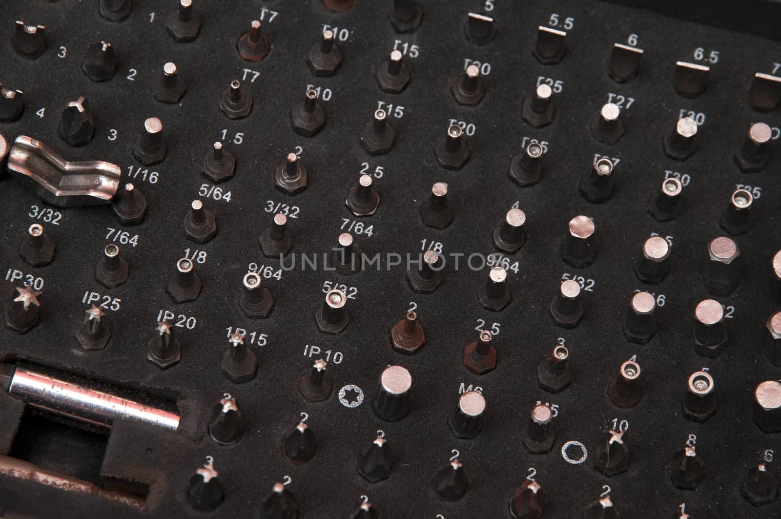 Several screws neatly stored in your briefcase