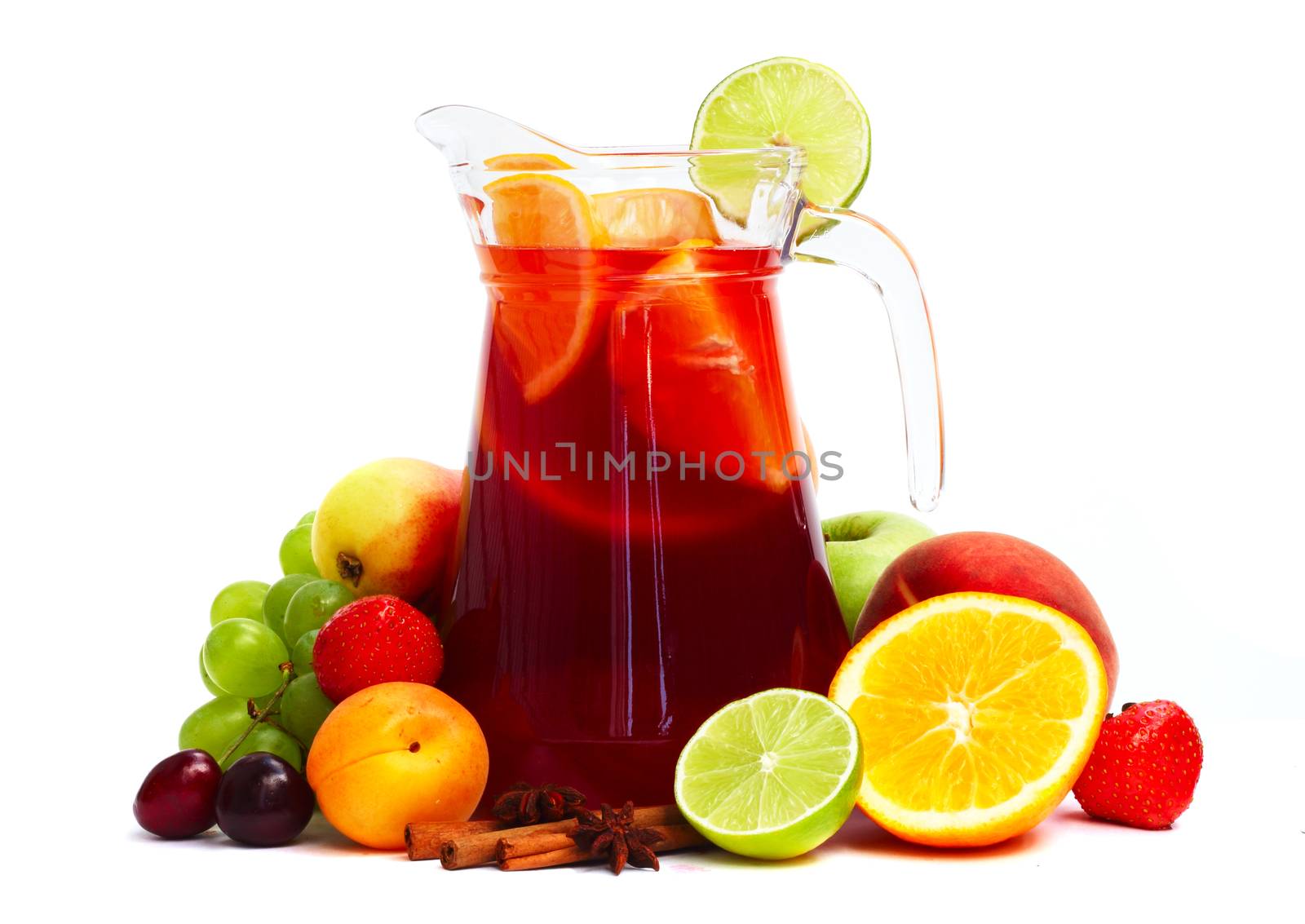 Refreshing fruit sangria in jug with different fruits solated on white