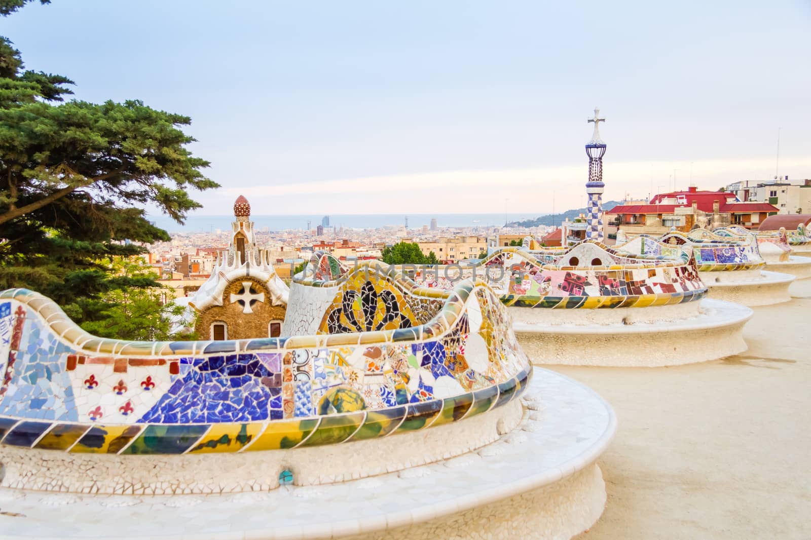 Colorful mosaic bench of park Guell, designed by Gaudi, in Barce by doble.d