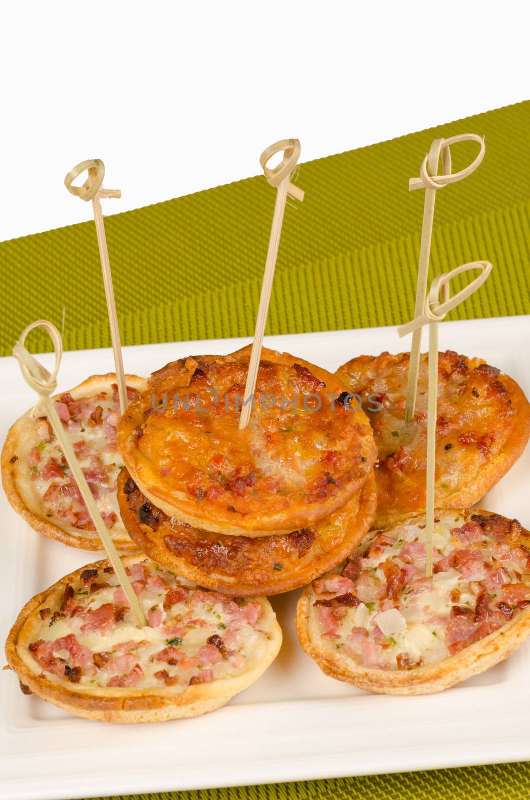 Portion of an assortment of small pizzas