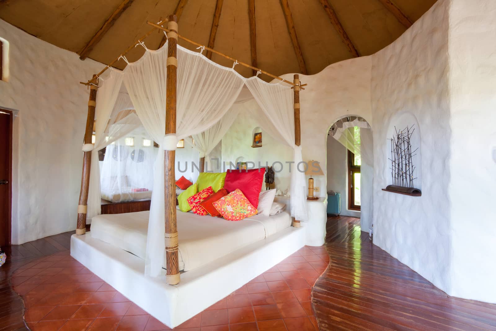 Mosquito net on the bed in Thai room