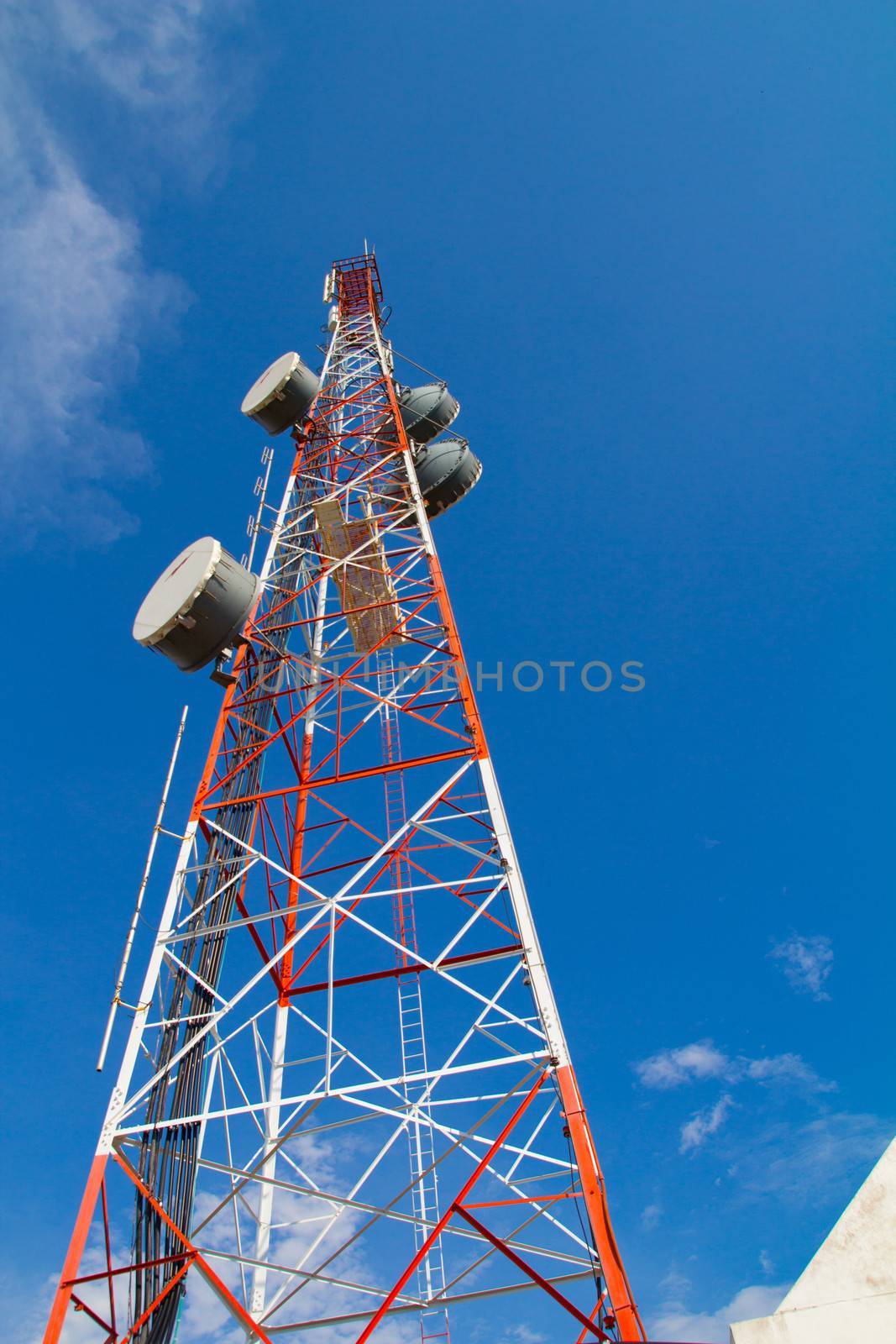 large communication tower with satelite dishes