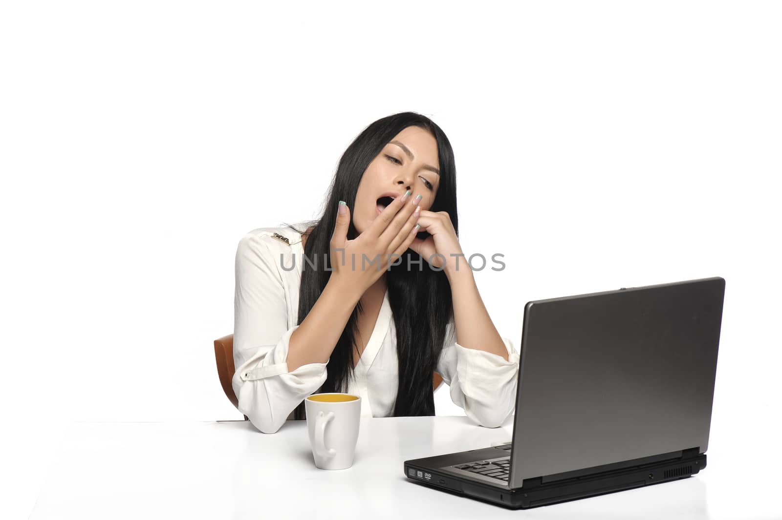 Bored business woman working on laptop looking very boring at the computer, Isolated white background